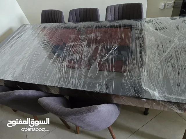 Stylish 8-Seater Dining Table with Plush Chairs