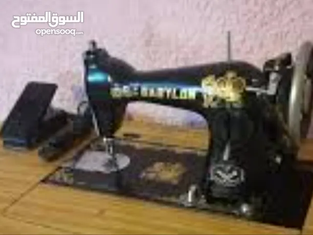 مكينة خياطة ام الاسدين مع ميز للبيع