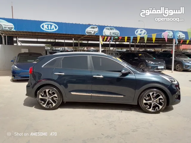 كيا نيرو تورنغ 2020 فل اوبشن عداد 57 الف كم اصلي 7جيد مجمرك أو بدون جمرك للإعفاءات الجمركية