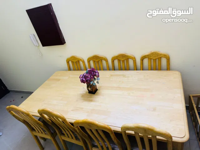 8 Seater Malaysian Made Wooden Dining Table with 8 Wooden Chairs in Good condition