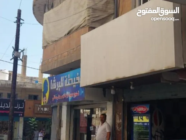 فرصة استثمارية مجمع تجاري وموقع مميز للبيع
