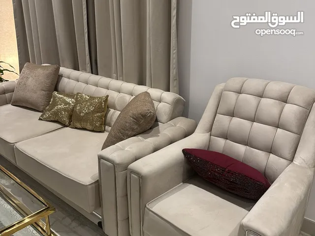 2 seater sofa cum bed and 2 seater sofa white one and two single sofas