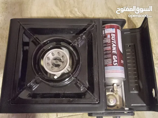 موقد للطبخ مستعمل مرتين فقط يعمل ب علبة غاز صغيرة على جانبه