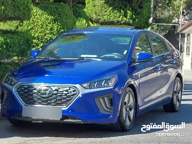 هونداي أيونيك 2021 لون ازرق ميتالك فل كامل اعلى صنف Limited مع فتحة فحص كامل جمرك جديد