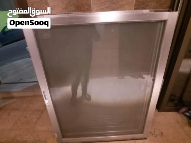 شبابك المنيوم لون سلفر و زجاج ساده