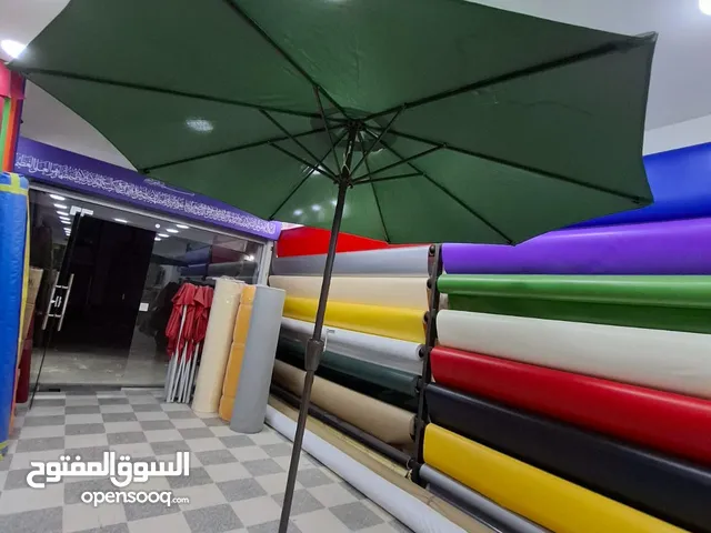 مظلات وحدائق خارجيه جميع الالوان والاحجام موجودين في ابو علندا والجلود جميع انواع الجلود والاقمشه