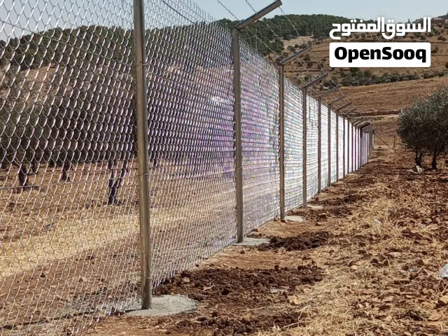 تشييك مزارع تشيك اراضي سياج شبك شييك مغلفن تزفيت طرق و تخطيط طرق و عزل اسطح بناء سناسل