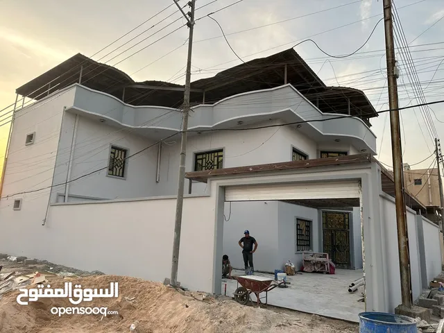 حسن الباخ وبياض واجهات حجر قرض ومقالات