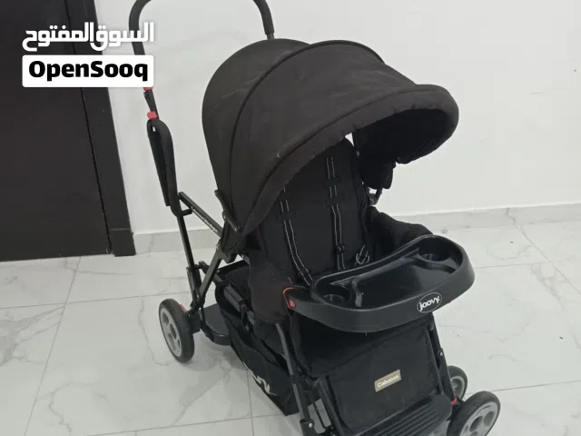 عربة الأطفال الثنائية Joovy Caboose Ultralight Sit and Stand. [1]