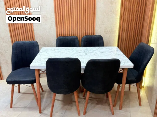 ميز طعام 6 كرسي سطح خشب ثابت  قياس الميز 80 * 130 سم  جوانب cnc  كرسي مخمل وتر بروف هيكل الكرسي حديد