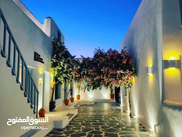 شاليه للبيع صف اول علي البحر متشطب بالتكييفات مع private garden في سيدي عبد الرحمن الساحل الشمالي