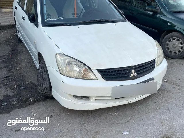 ميتسوبيشي لانسر موديل 2010 GLX لون ابيض مطلوب 4500  الفحص مرفق بالصور الرقم  0096279108817