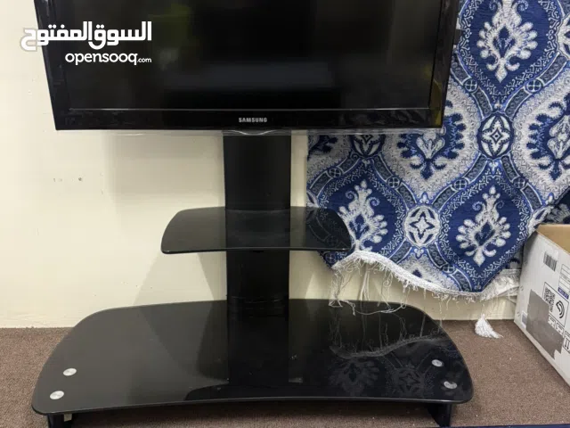 تلفزيون + طاوله