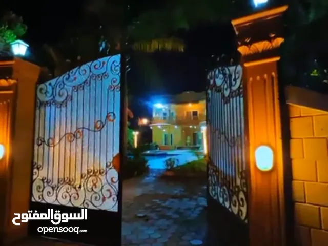 1400 m2 More than 6 bedrooms Villa for Sale in Giza Mansuriyya