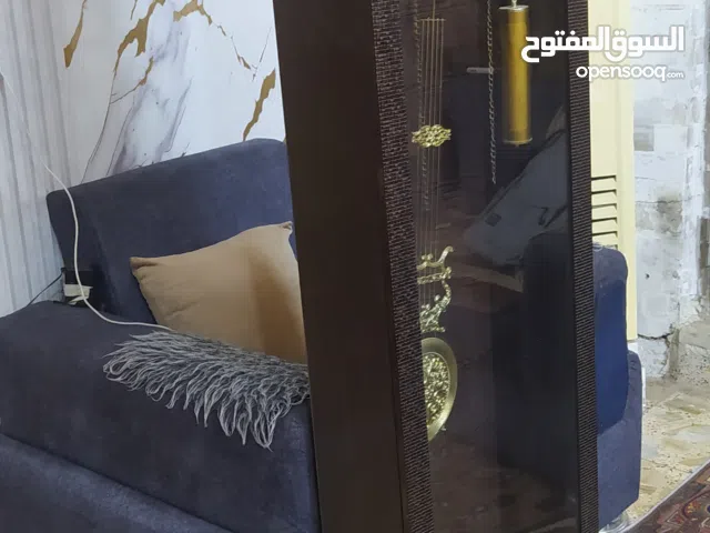 ساعة عاموديه خشب اخت الجديده