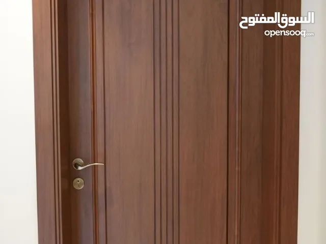 أبواب خشب ديربزن درج شبابيك نوافذ غرف نوم دواليب طاولات ماسات كراسي مكاتب ديكورات أبواب خشب زان