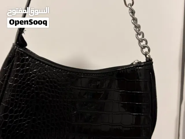 Black shoulder bag with silver chain with faux crocodile leather