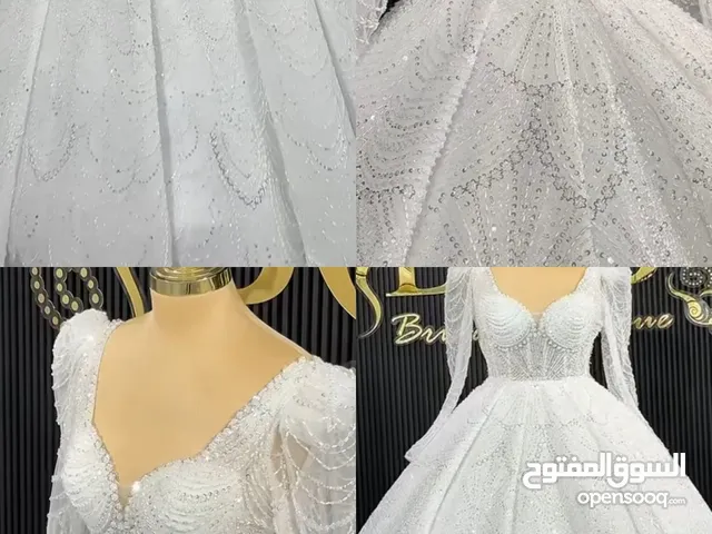 فستان عرس مستعمل للبيع لضرورة القسوة ابيض نفاش مع شاحط بسطل للامانه متل سندريلا
