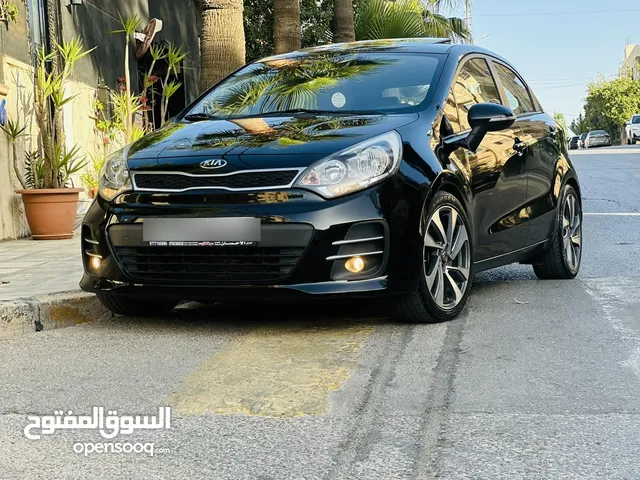 كيا ريو 2016 فل مع فتحه مميزه لون اسود نادر ومميز بالنضافه