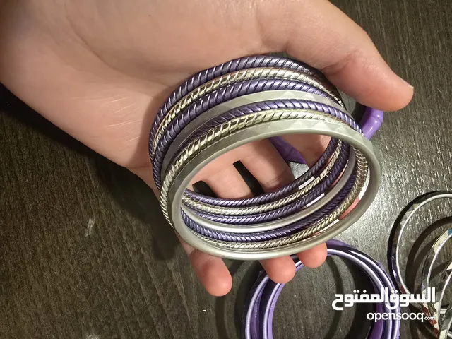 اساور بلاستيك بنفسجي، وفضي عدد 15