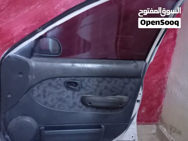 أبواب اكسنت 96 انظاف وكاله ولامعجونه ولاصدا كاملات زجاج مواكن البطانه امامي خلفي يمين