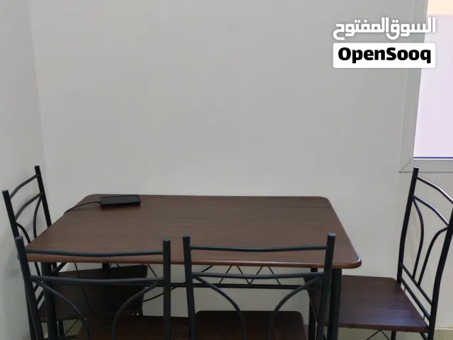 Wooden table with 4 steel chairs