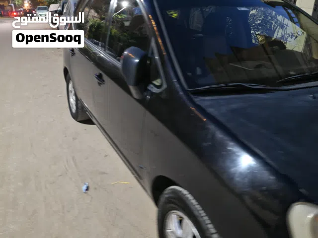 2010 كيا كارينز Standard