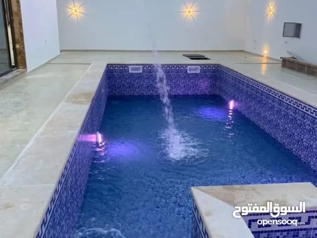 فني ليبي أحواض السباحة وسباكة منطومات تاجوراء.