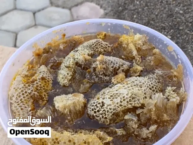 عسل بشمعه بطويق جبلي مال سنه عسل صافي برم ما شاء الله ومضمون