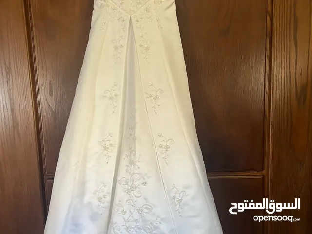 Wedding dress ( dry cleaned and used only once )