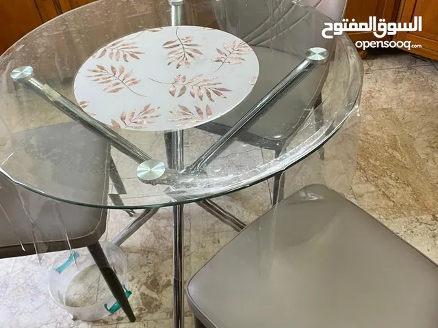 ميز طعام زجاجي مع اربع كراسي
