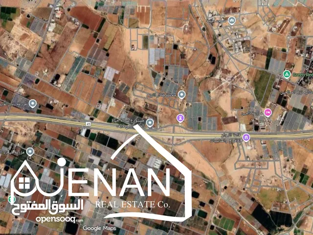 أرض مميزة للبيع الطنيب على شارع عمان التنموي ( شارع المية ) مباشرة مساحة 13340 متر واجهة عريضة
