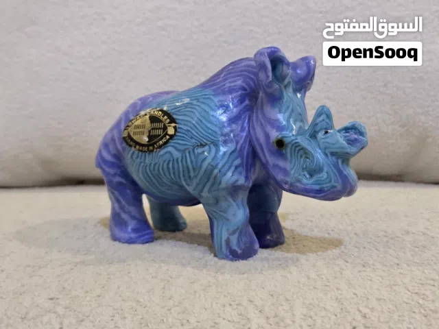 شمعة "وحيد قرن" ملكية - صناعة يدوية أفريقية نادرة (تحفة ديكور)