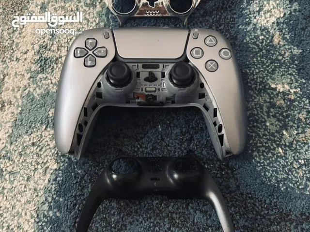 Silver Ps5 controller with silver accessories and box