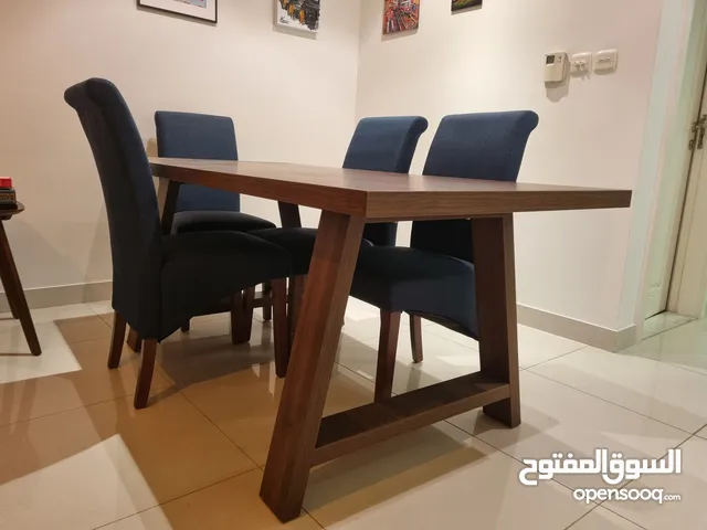 Wooden Dining Table with Six Blue Chairs